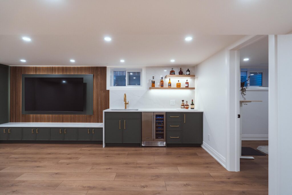 🏠Basement Goals, Brought to Life by 804 Group 🏠Description: A basement that’s anything but ordinary. This stunning lower-level renovation by 804 Group blends modern craftsmanship with cozy, elevated living — complete with a sleek built-in bar, entertainment wall, and warm wood tones that make it the perfect place to unwind or entertain. As a trusted Burlington contractor and Oakville construction company, 804 Group continues to raise the bar for luxury renovations, remodels, and custom builds across the GTA. Known as one of the best renovation and remodeling companies in Burlington, our team creates inspired spaces that reflect your lifestyle — from beautiful house additions to reimagined basement living areas and more. We’re here to bring your vision to life. Whether you’re planning a high-end renovation, a custom build, or need a trusted general contractor, our team is ready to help. Reach out today to start a conversation about your project and discover how 804 Group can turn your ideas into reality with unmatched craftsmanship and care. 👉 https://www.804group.ca/contact A photo of a local contractor who works in burlington and oakville doing renovations, remodels and additions as a burlington renovations, burlington remodels burlington additions and burlington custom homes general contrac